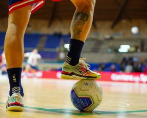 player-with-foot-on-a-soccer-ball-indoors-o8p7dugz1ka